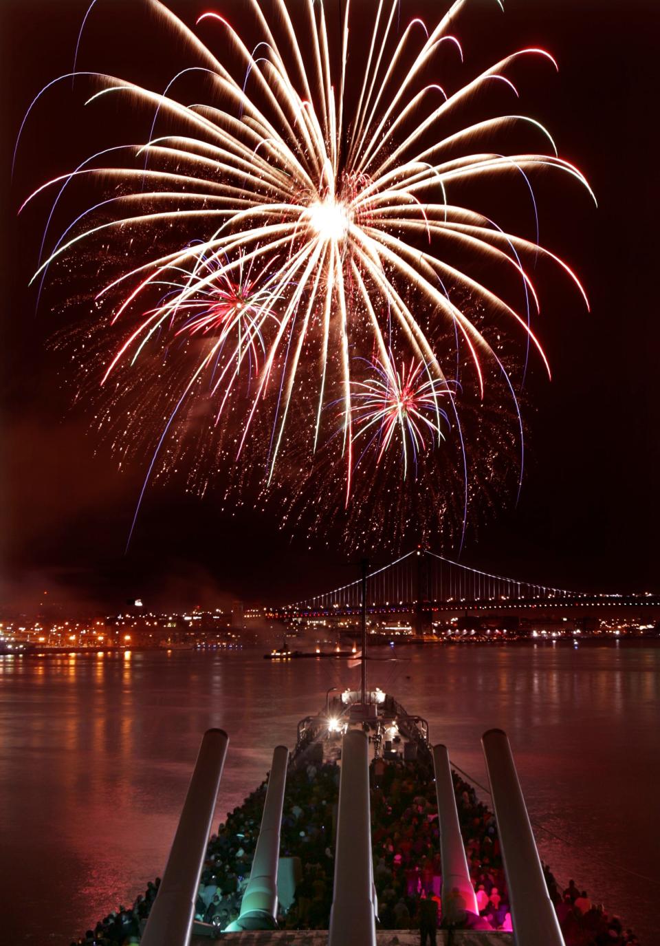 Annual Fireworks over the Delaware River as viewed from the Battleship New Jersey Museum and its gun turrets in Camden across from Philadelphia. Reservations are available on board the ship for viewing for only the $10 parking fee.