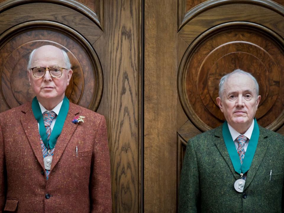 Gilbert and George after receiving their medals at the Royal Academy of Arts in 2017 (Getty)