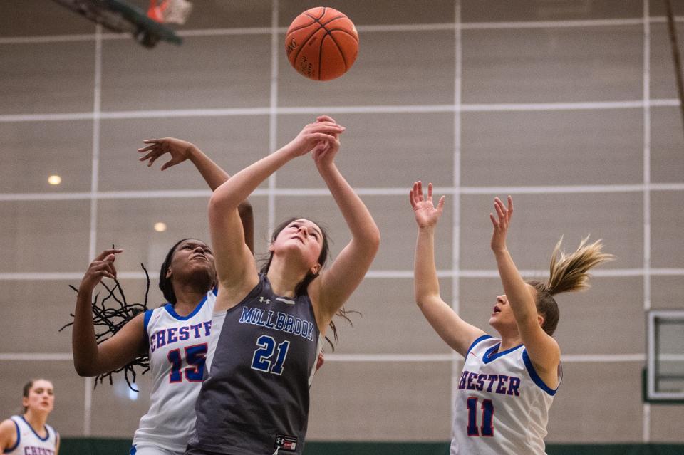 Millbrook's Natalie Fox, center, reaches for the rebound ball during the Section 9 Class C girls championship game SUNY Sullivan in Loch Sheldrake, NY on Wednesday, March 2, 2022. Millbrook defeated Chester. KELLY MARSH/FOR THE TIMES HERALD-RECORD