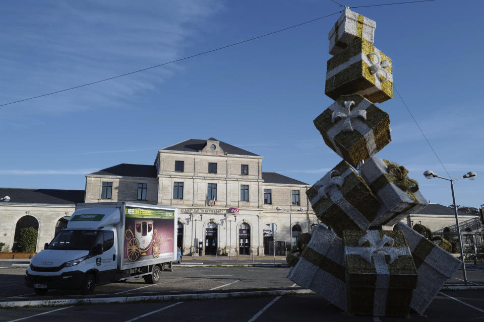 The train station in Libourne, southwest France, Monday, Nov. 23, 2020, where postal workers who call themselves "Elves" open envelopes addressed to "Pere Noel" - Father Christmas in French. Letters pouring by the tens of thousands into Santa's mailbox offer a glimpse into the worries and hopes of children awaiting a pandemic-hit Christmas. Along with usual pleas for toys and gadgets, kids are also mailing requests for vaccines, for visits from grandparents, for life to return to the way it was. The office estimates that one letter in three mentions the pandemic. (AP Photo/Francois Mori)