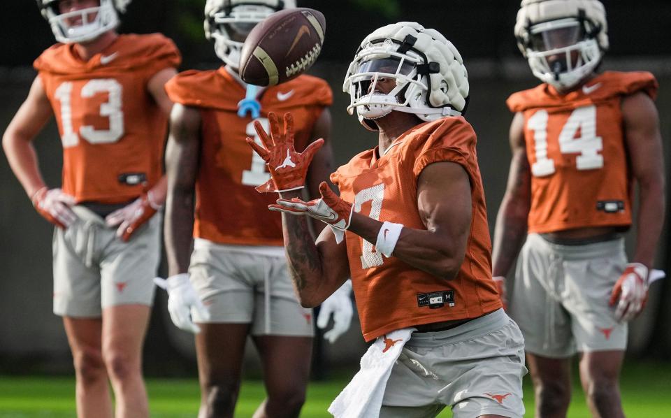 New Texas wide receiver Isaiah Bond, a transfer from Alabama, catches a pass during the Longhorns' first spring football practice Tuesday at Denius Field. Texas' top four pass catchers from 2023 have moved on, leaving the receivers' room looking for replacements.