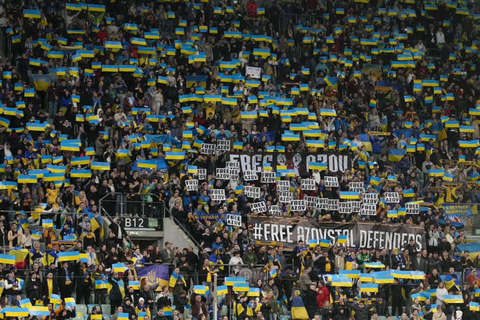 Ukrainian fans support their team prior the Euro 2024 qualifying play-off soccer match between Ukraine and Iceland, at the Tarczynski Arena Wroclaw in Wroclaw, Poland, Tuesday, March 26, 2024. (AP Photo/Czarek Sokolowski)