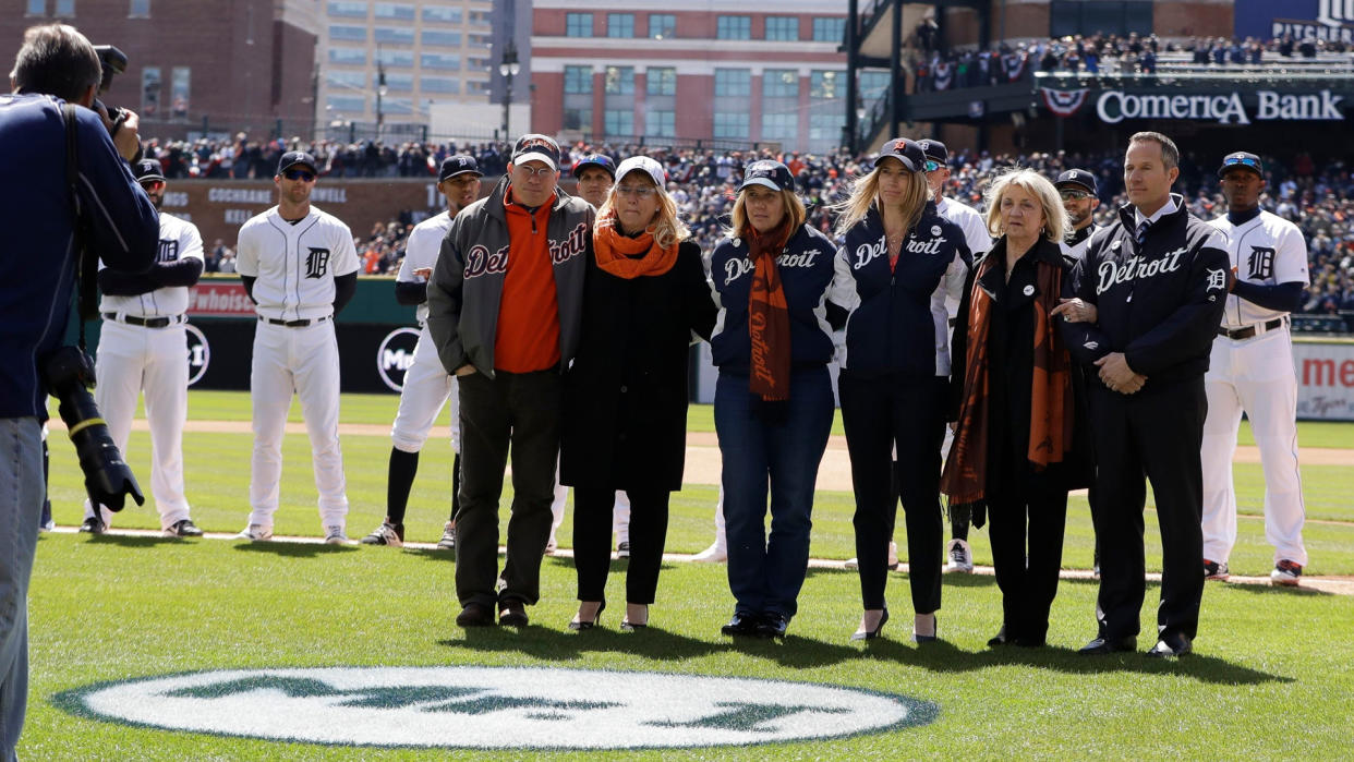 Mandatory Credit: Photo by AP/Shutterstock (8586798h)The Ilitch family stands next to a logo in tribute to Mike Ilitch during a ceremony before a baseball game against the Boston Red Sox, in DetroitRed Sox Tigers Baseball, Detroit, USA - 07 Apr 2017.