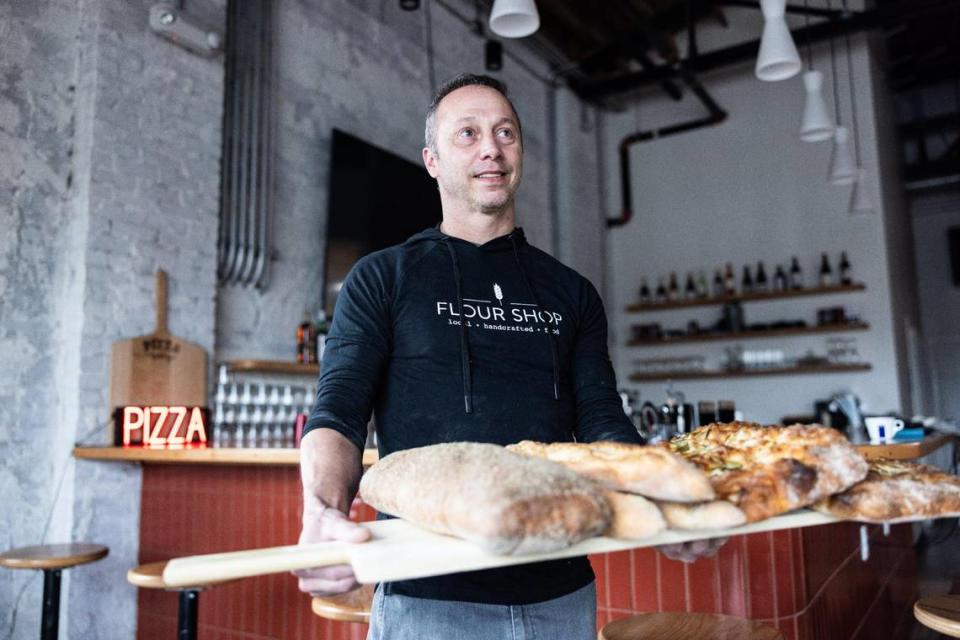 Trey Wilson, photographed at Pizza Baby in Charlotte, plans to open a second area location of the pizza joint soon. He sold his majority stake in Customshop in 2022. Khadejeh Nikouyeh/Knikouyeh@charlotteobserver.com