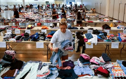 Firefighters begin grim task of searching for bodies in Houston after Harvey moves on 