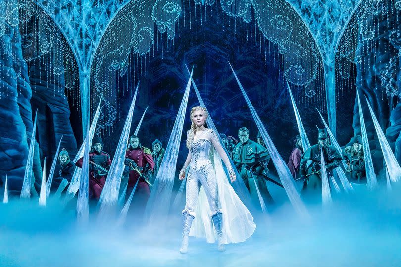 A princess on stage in a frosty fairytale scene