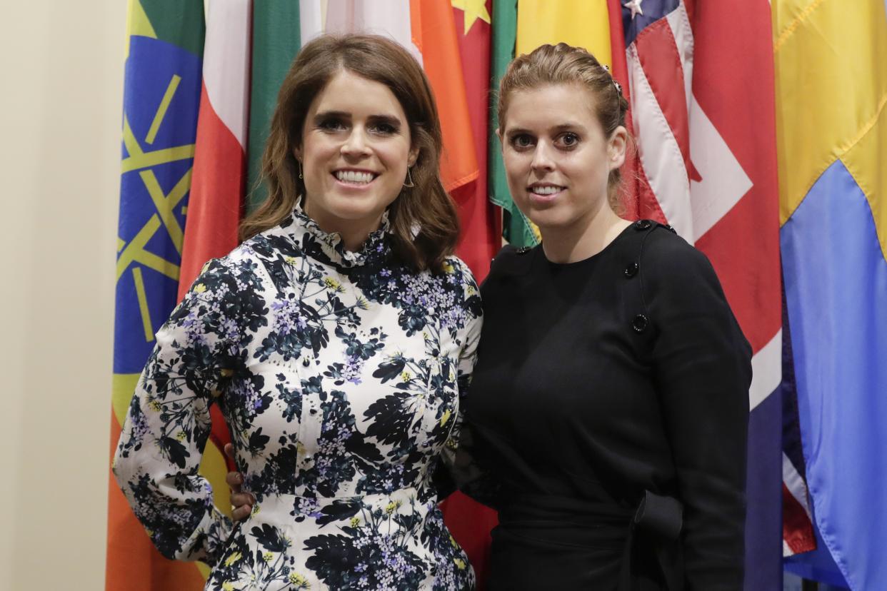 Princess Eugenie and her Sister Princess Beatrice of York posing in front of the flags of several nations at the United Nations in New York City, New York, July 26, 2018. (Photo by EuropaNewswire/Gado/Getty Images)