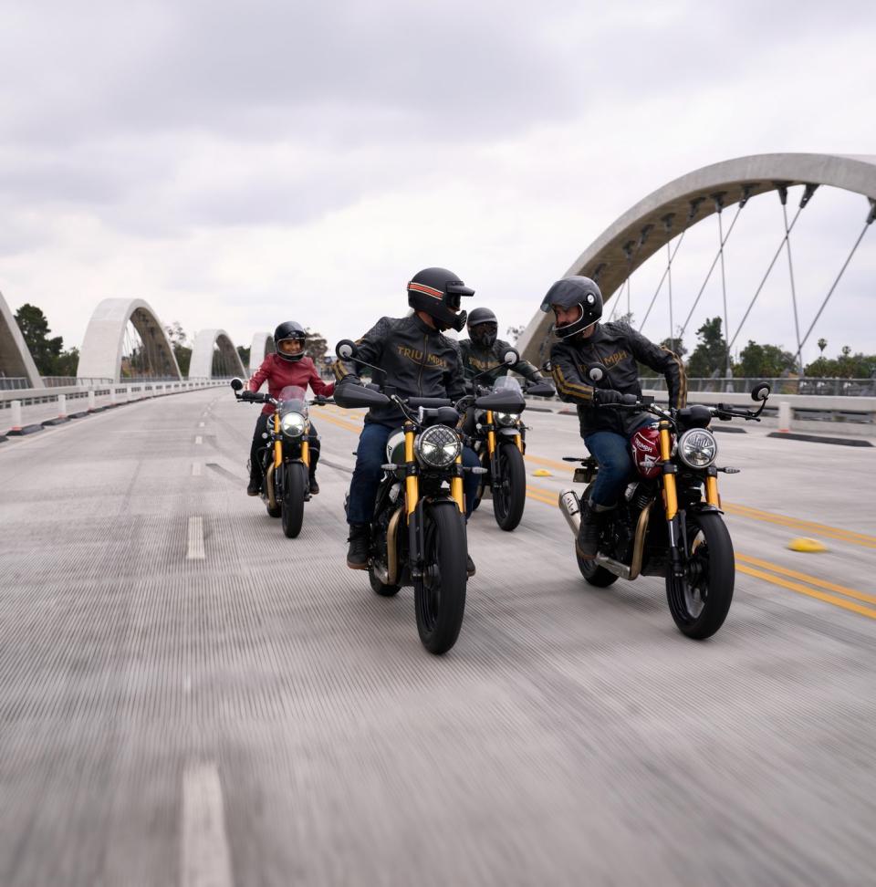 a group of people on motorcycles on a road
