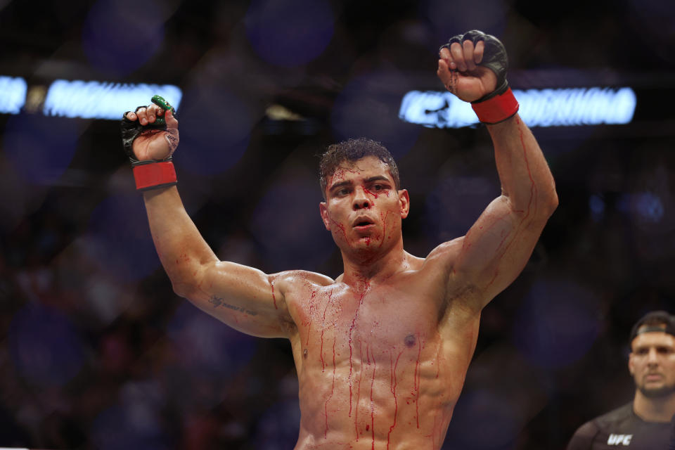 Aug 20, 2022; Salt Lake City, Utah, USA; Paulo Costa (red gloves) reacts after defeating Luke Rockhold (blue gloves) during UFC 278 at Vivint Arena. Mandatory Credit: Jeffrey Swinger-USA TODAY Sports