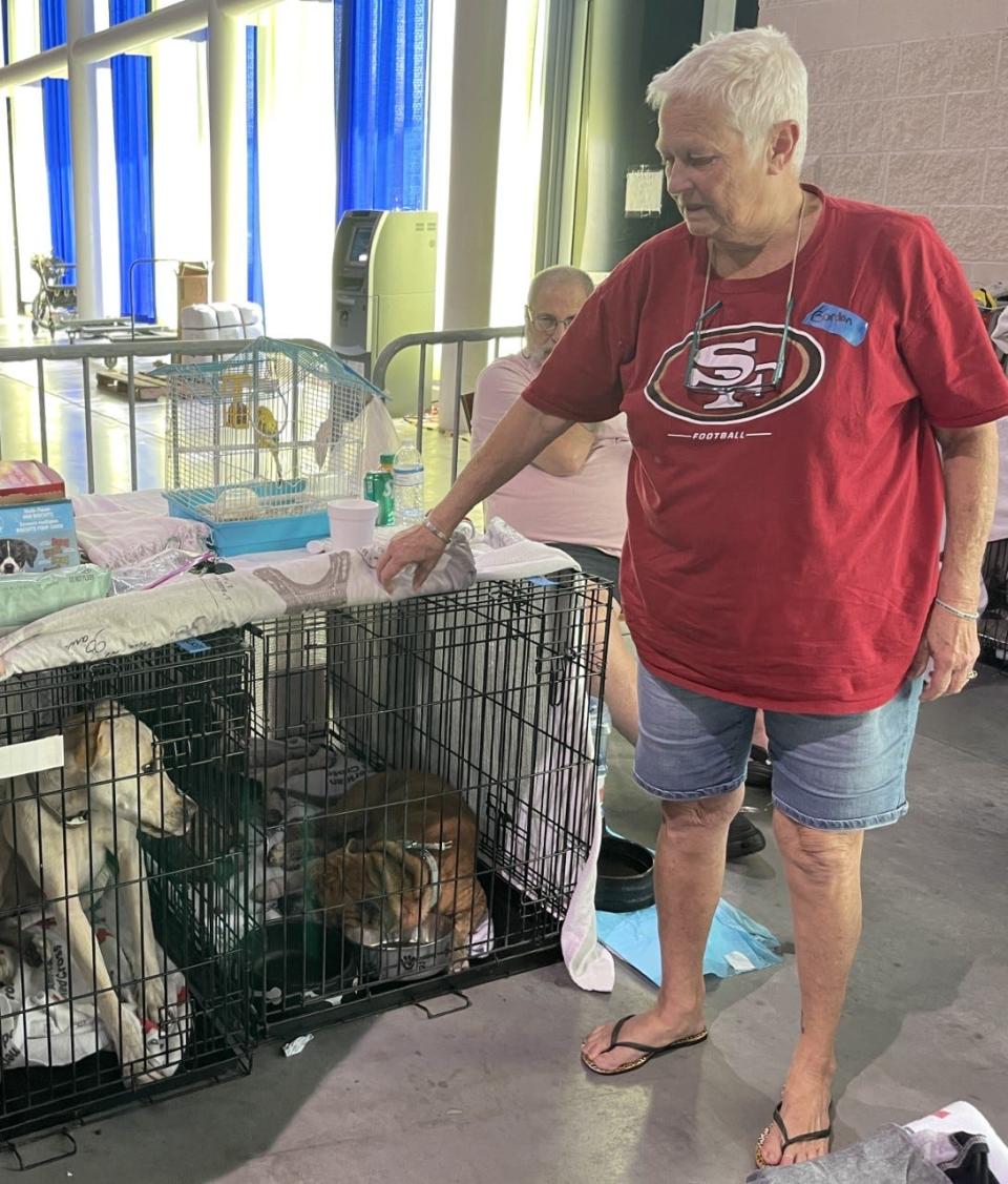 Darlene Gordon, of New Smyrna Beach, her family of 7 and two dogs, shelter at the Ocean Center. The American Red Cross is running a shelter for victims of floods caused by Tropical Storm Ian. Their home on Wayne Avenue was flooded.