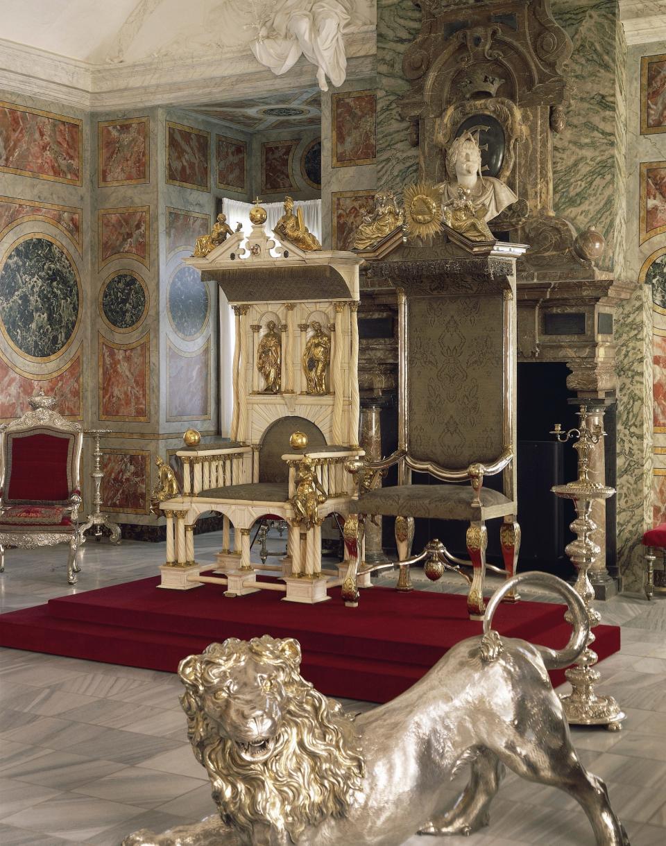 Two royal thrones: the King's throne, in narwhal tooth, built in 1671 for the coronation of Christian V, the Queen's throne, in silver, built in 1731. Knights Hall, Rosenborg Castle in Copenhagen. Denmark, 17th-18th century.