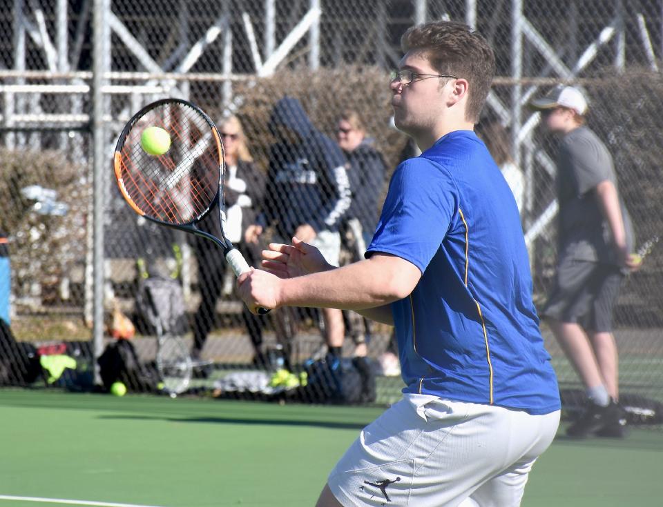 Mt. Markham Mustang Nathan Hartman hits a backhand return during Friday's No. 1 singles match against Little Falls.