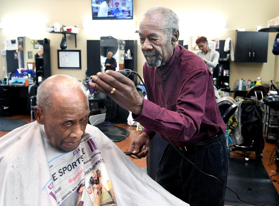 Vernon Winfrey cuts Leroy McMurray's hair at Winfrey’s barbershop in east Nashville on Jan. 11, 2018. Vernon Winfrey has owned Winfrey’s Barbershop since 1965. 