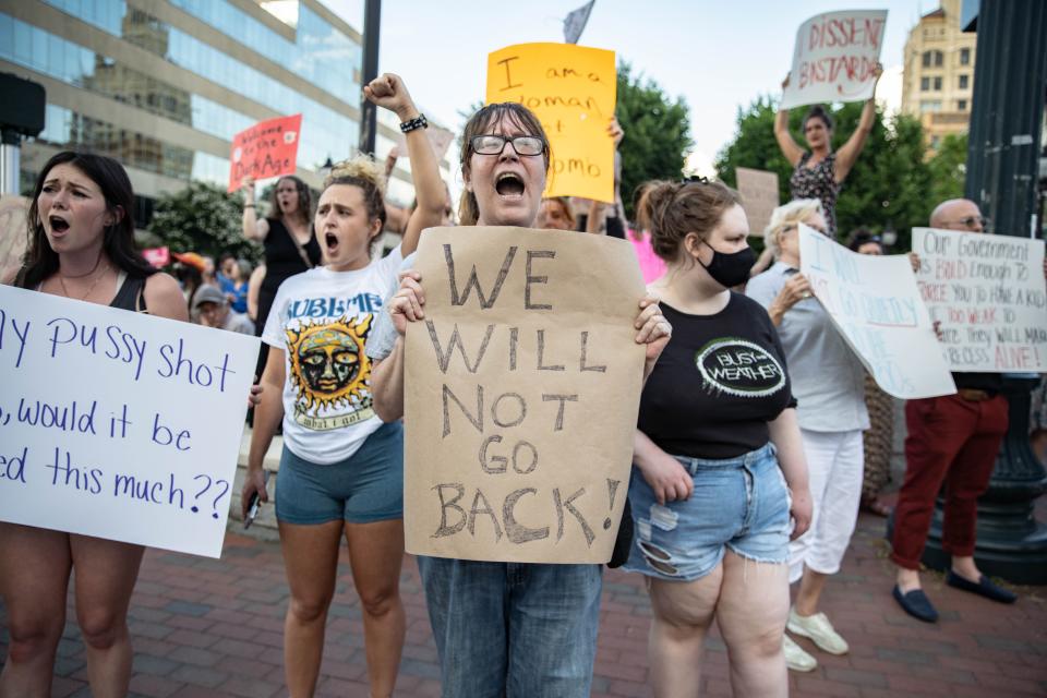 Mikki Fox, 53, chants at abortion rights rally in downtown Asheville on June 24, 2022. "I'm doing this for my two daughters. My mother did back in the day for me. This is ridiculous," Fox said.