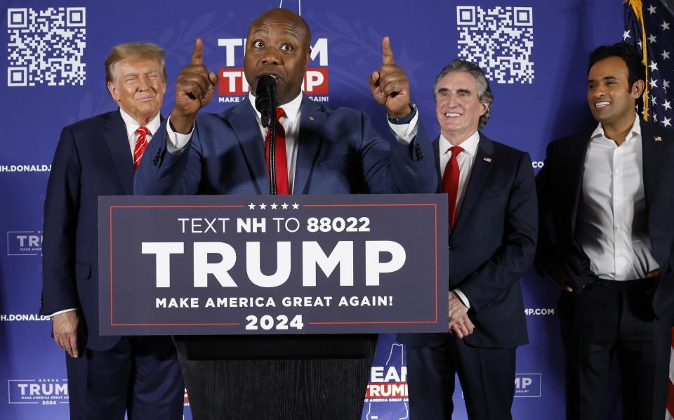 Tim Scott speaks at a Donald Trump rally in Laconia on Monday night alongside Doug Burgum and Vivek Ramaswamy