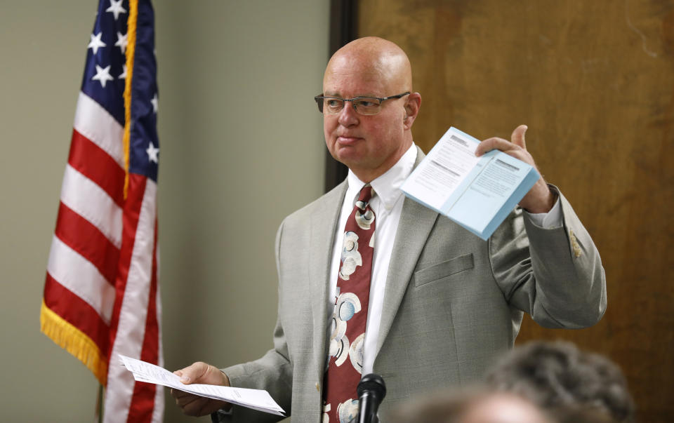 Johnson County Election Commissioner Ronnie Metsker speaks during the Johnson County Board of Canvassers, Monday, Aug. 13, 2018, in Olathe, Kan. County election officials across Kansas on Monday began deciding which provisional ballots from last week's primary election will count toward the final official vote totals, with possibility that they could create a new leader in the hotly contested Republican race for governor. Secretary of State Kris Kobach led Gov. Jeff Colyer by a mere 110 votes out of more than 313,000 cast as of Friday evening. (AP Photo/Charlie Neibergall)