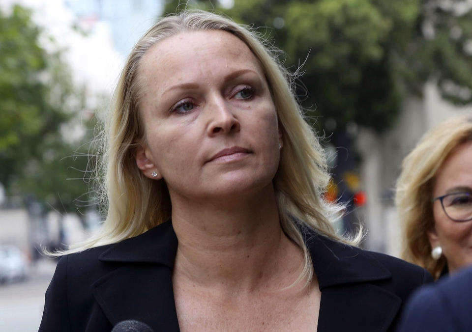 FILE - In this June 13, 2019, file photo, Margaret Hunter, wife of indicted Republican U.S. Rep. Duncan Hunter, arrives at the federal courthouse in downtown San Diego. Duncan Hunter, who is facing corruption charges, wants his Sept. 10 trial postponed while his attorneys appeal a judge's refusal a month earlier to dismiss the case. Hunter and his wife are accused of misusing $250,000 in campaign funds. Margaret Hunter pleaded guilty to one count. (John Gibbins/The San Diego Union-Tribune via AP, File)