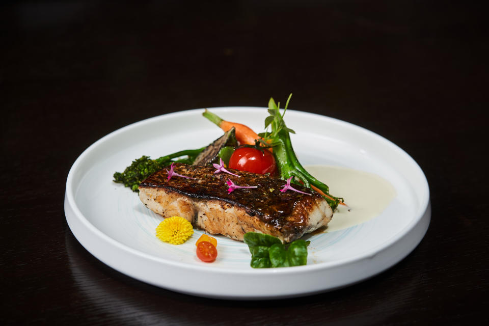 A plate featuring Barramundi, Honey Soya Emulsion and Cauliflower Rice 