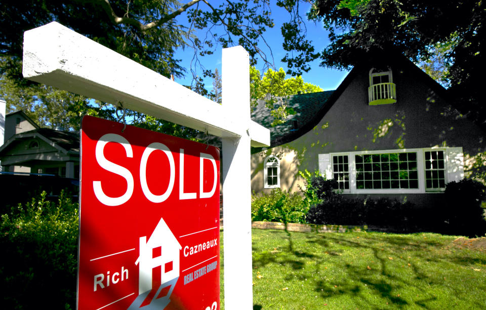 In this photo taken Wednesday, July 5, 2017 a sold sign is displayed in front of a house in Sacramento, Calif. The state Senate approved a measure, SB2, by Sen. Toni Atkins, D-San Diego, Thursday, July 6, 2017, that imposes  a $75 fee on real estate transaction documents such as deeds and notices with a cap of $225 per transaction. The fee is expected to generate between $200 and $300 million annually for affordable housing projects. The bill now goes to the Assembly. (AP Photo/Rich Pedroncelli)