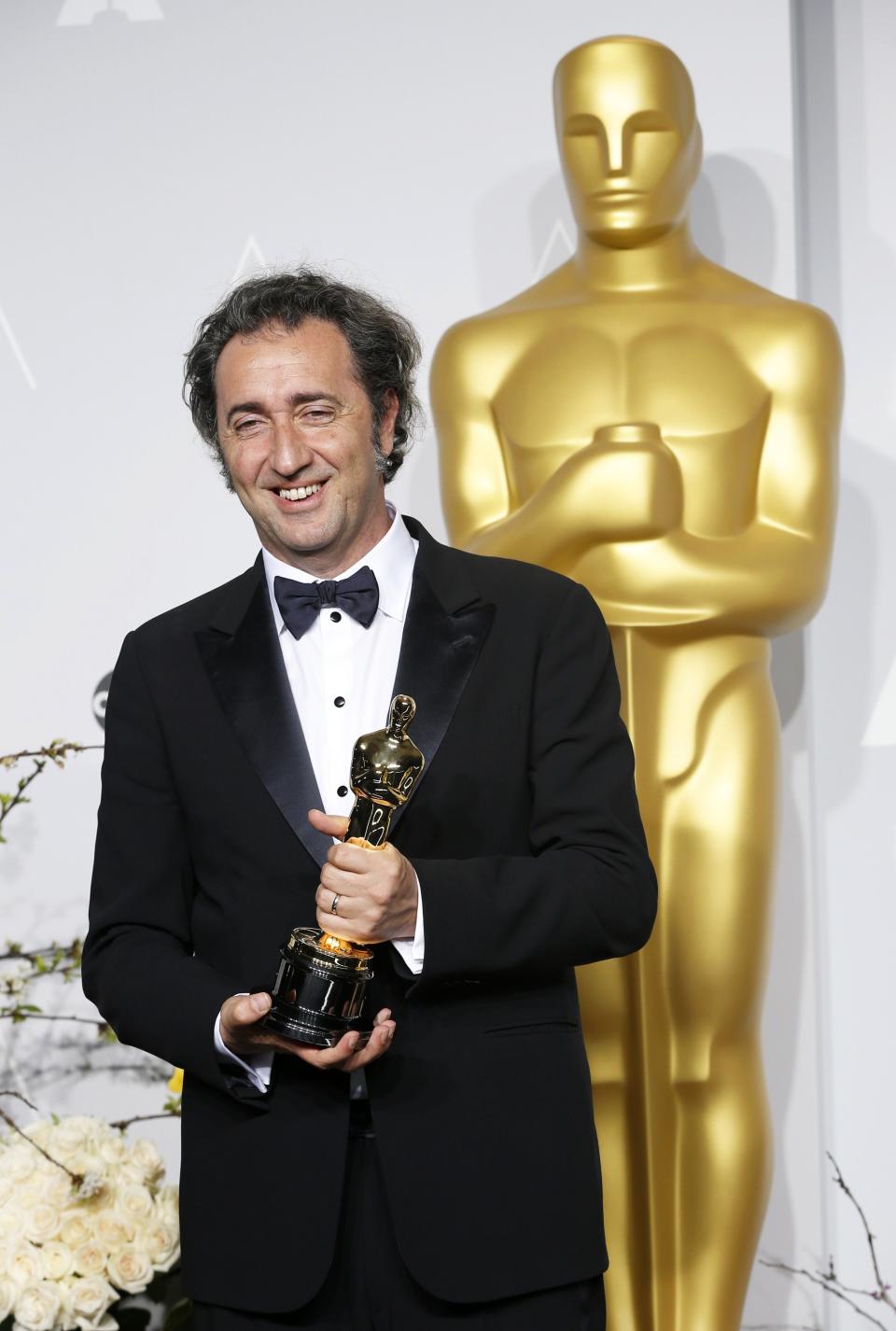Paolo Sorrentino, director of Italian film "The Great Beauty" poses with his award for Best Foreign Language Film at the 86th Academy Awards in Hollywood on March 2, 2014. (REUTERS/Mario Anzuoni)
