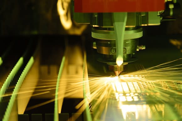 A fiber laser cutting through sheet steel.