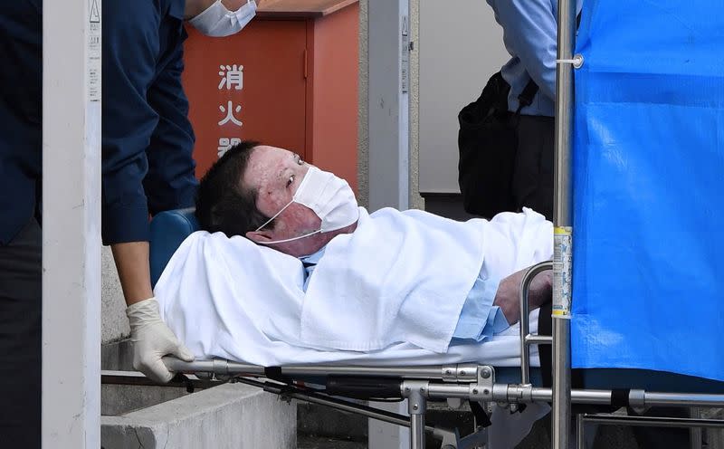 Shinji Aoba, a suspected arsonist who is suspected of killing 36 people at Kyoto Animation in July 2019, is seen on a stretcher as he is carried to Fushimi police station after being arrested in Kyoto, Japan