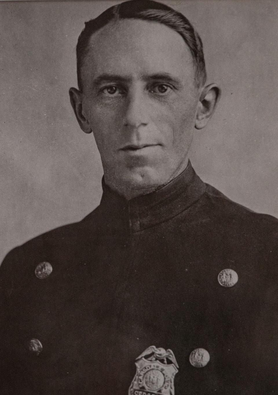 A photo hanging in Scarsdale police headquarters of Sgt. John Harrison, who was killed in the line of duty 100 years ago. On July 19, 2023, police and village officials held a wreath laying ceremony marking the 100th anniversary of Sgt. John HarrisonÕs death. Harrison was killed when he left the police desk at 4:30 am on July 19, 1923, on a report of a stolen car nearby and was fatally shot by one of the thieves less than 200 feet from headquarters.