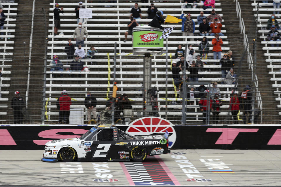 NASCAR Texas Trucks Series driver Sheldon Creed (2) crosses the finish line to win an auto race at Texas Motor Speedway in Fort Worth, Texas, Sunday, Oct. 25, 2020. (AP Photo/Richard W. Rodriguez)