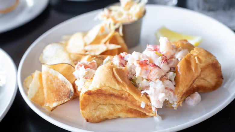 Lobster roll with chips and slaw