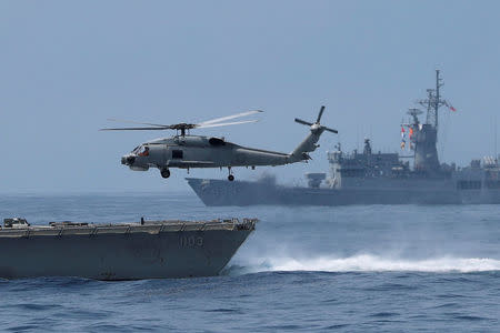 A Sikorsky S-70 takes off from Cheng Ho (PFG-1103) Cheng Kung class frigate (Oliver Hazard Perry class) during a drill near Yilan naval base, Taiwan April 13, 2018. REUTERS/Tyrone Siu