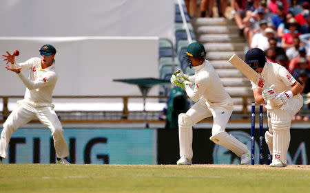 Cricket - Australia v England - Ashes test match - WACA Ground, Perth, Australia, December 17, 2017 - Australia's captain Steve Smith takes a catch to dismiss England's captain Joe Root during the fourth day of the third Ashes cricket test match. REUTERS/David Gray