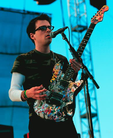 <p>Tim Mosenfelder/getty</p> Weezer at Coachella 2001