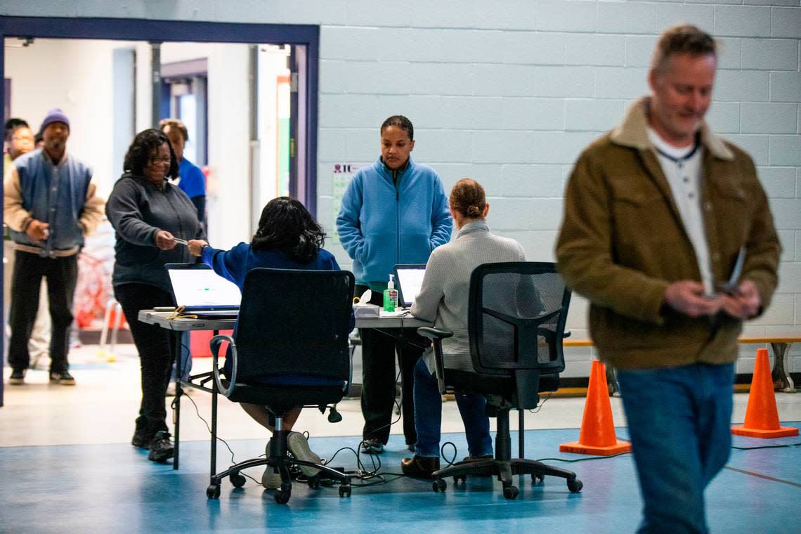 The first Democratic primary voters of the morning check in at the Meadowfield Elementary polling place on Saturday, February 29, 2020. Polls open at 7 a.m and close at 7 p.m.