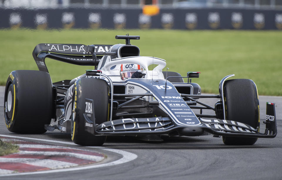 Alpha Tauri driver Pierre Gasly, of France, takes a turn at the Senna corner during the first practice session at the Formula One Canadian Grand Prix auto race in Montreal, Friday, June 17, 2022. (Graham Hughes/The Canadian Press via AP)