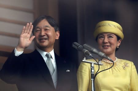 FILE PHOTO - Japan's Emperor Naruhito and Empress Masako greet well-wishers during their first public appearance at the Imperial Palace in Tokyo