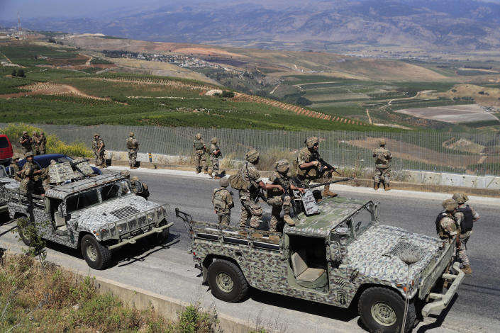 Lebanese army soldiers deploy at the Lebanese side of the Lebanese-Israeli border in the southern village of Kfar Kila, Lebanon, Saturday, May 15, 2021. (AP Photo/Hussein Malla)