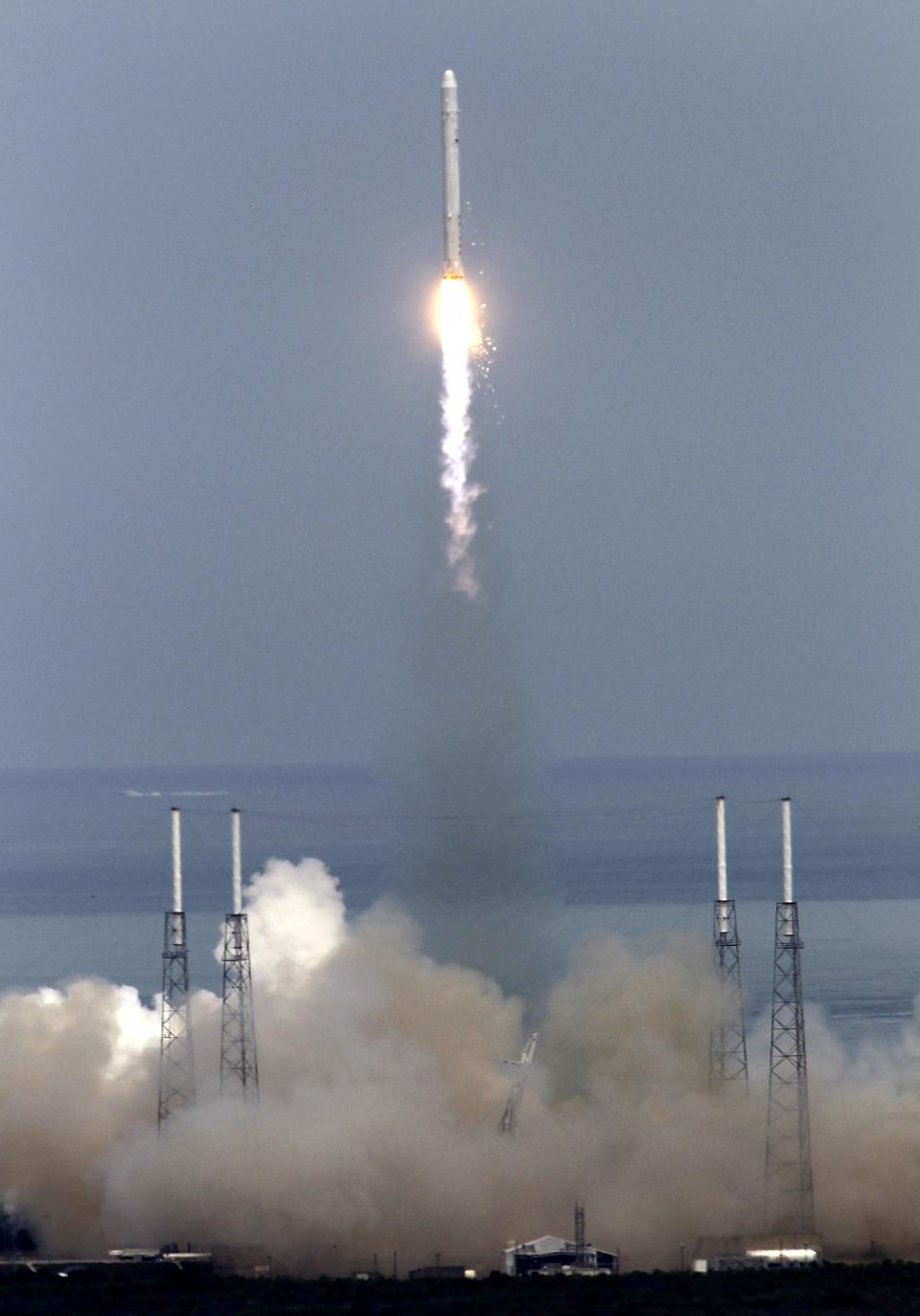 FILE - In this June 4, 2010 photo, the SpaceX Falcon 9 test rocket lifts off from complex 40 at the Cape Canaveral Air Force Station in Cape Canaveral, Fla. A launch scheduled for Saturday, May 19, 2012, will mark for the first time, a private company will send its own rocket to the orbiting International Space Station, delivering food and ushering in a new era in America's space program. (AP Photo/John Raoux, File)