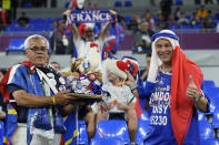 FILE - Fans of France cheer prior to the World Cup group D soccer match between France and Denmark at the Stadium 974 in Doha, Qatar, Saturday, Nov. 26, 2022. At a World Cup that has become a political lightning rod, it comes as no surprise that soccer fans’ sartorial style has sparked controversy. At the first World Cup in the Middle East, fans from around the world have refashioned traditional Gulf Arab headdresses and thobes. (AP Photo/Martin Meissner, File)