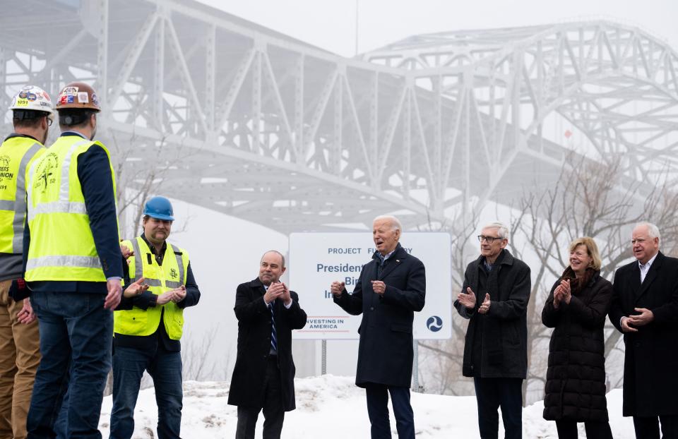 US President Joe Biden, center, visits the John A. Blatnik Memorial Bridge in Superior, Wisconsin, on January 25, 2024. Biden announced some $5 billion in federal funds to upgrade the bridge and other infrastructure projects nationwide. To Biden's left are Wisconsin Gov. Tony Evers, U.S. Tammy Baldwin of Wisconsin and Minnesota Gov. Tim Walz. (Photo by SAUL LOEB / AFP) (Photo by SAUL LOEB/AFP via Getty Images)