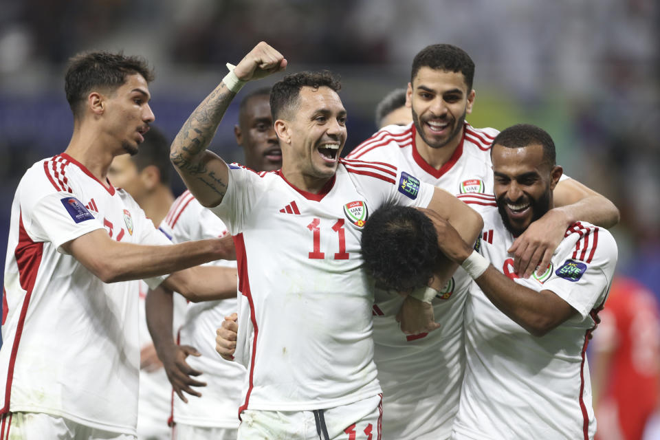 United Arab Emirates players celebrates after their team scores a goal during the Asian Cup Group C soccer match between Hong Kong and United Arab Emirates at Khalifa International Stadium in Doha, Qatar, Sunday, Jan. 14, 2024. (AP Photo/Hussein Sayed)