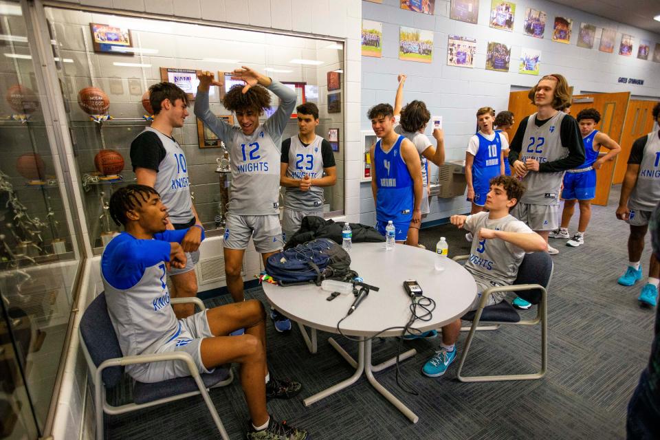 Marian players wait to be interviewed during the media availability for the Marian boys basketball team Tuesday, March 22, 2022 at Bethel University. 