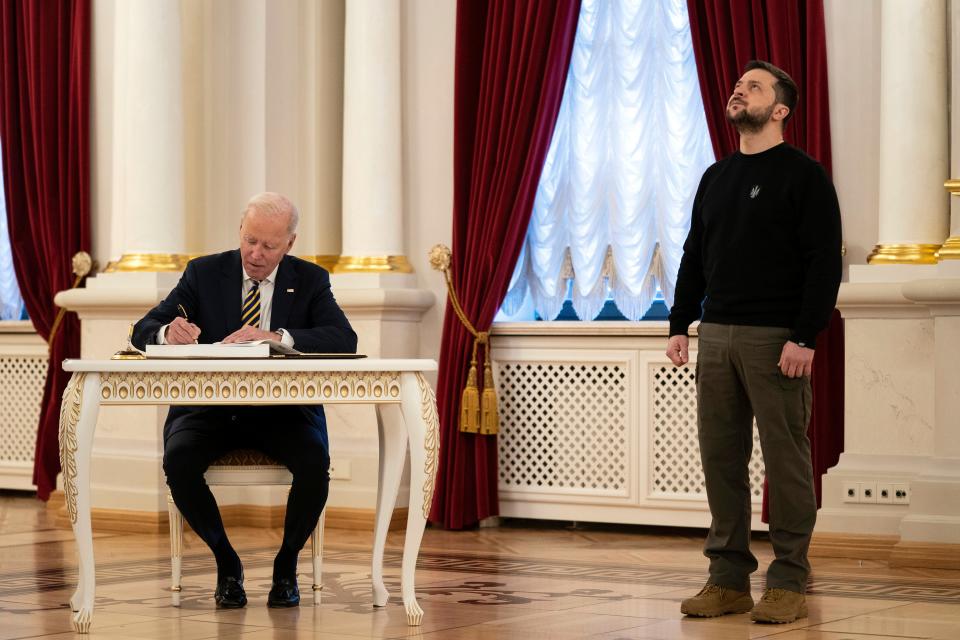 US President Joe Biden signs a guest book during his meeting with Ukrainian President Volodymyr Zelensky (Copyright 2023 The Associated Press. All rights reserved)