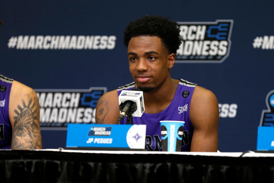 Mar 16, 2023; Orlando, FL, USA; Furman Paladins guard JP Pegues (1) speaks to the media following the game against the Virginia Cavaliers at Amway Center. Mandatory Credit: Russell Lansford-USA TODAY Sports