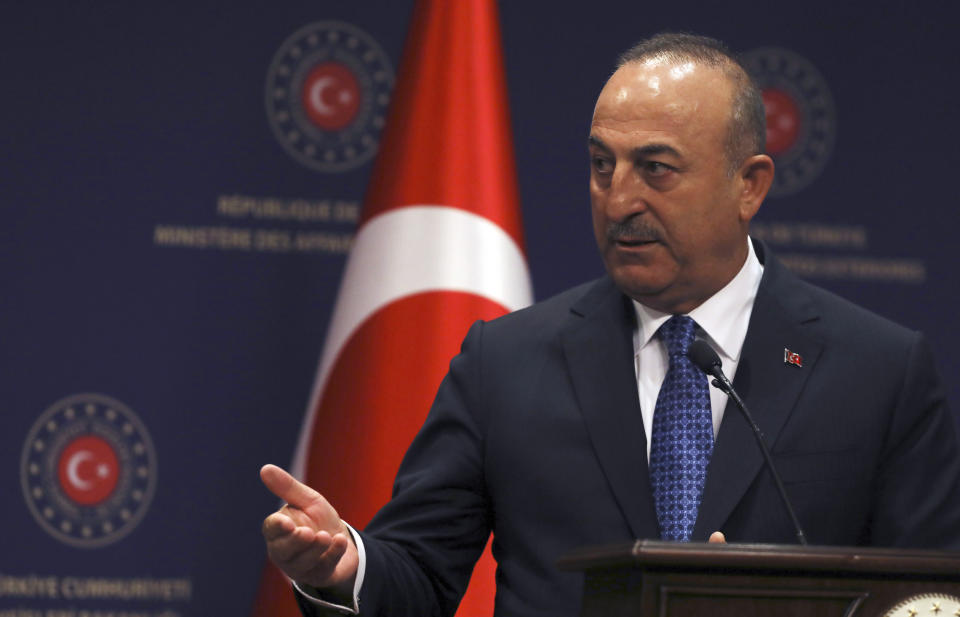 Turkish Foreign Minister Mevlut Cavusoglu speaks to the media during joint news conference with Israeli Foreign Minister Yair Lapid, in Ankara, Turkey, Thursday, June 23, 2022. Lapid on Thursday thanked Turkish authorities for their cooperation in allegedly foiling attacks against Israeli citizens in Turkey and warned Israel would not "sit idly by " in the face of threats to its citizens from Iran.(AP Photo/Burhan Ozbilici)