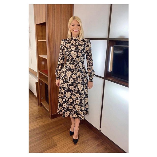 <p>Holly really went for it with this pretty patterned midi dress.</p><p><strong>Goat</strong></p><p>Goldfinch Midi Dress</p><p><a class="link " href="https://www.goatfashion.com/goldfinch-dress-black-camelia" rel="nofollow noopener" target="_blank" data-ylk="slk:BUY NOW;elm:context_link;itc:0;sec:content-canvas">BUY NOW</a></p>