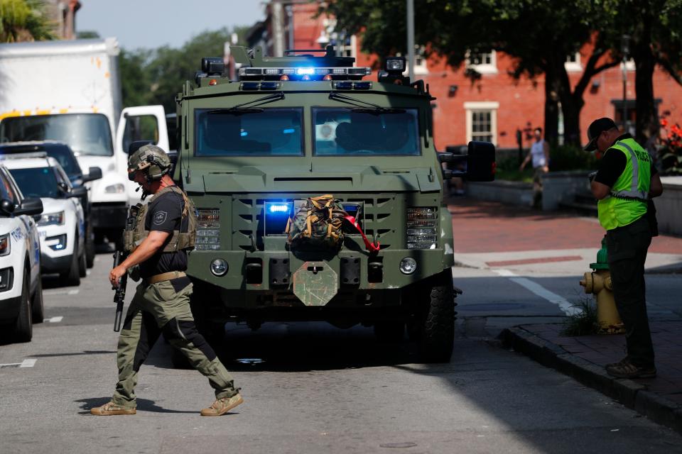 A member of the Savannah Police Department S.W.A.T. team walks across West Congress Street during active shooter training.