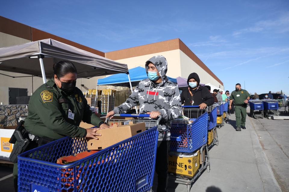 El Paso Border Patrol Chief Gloria Chavez volunteers with other Customs and Border Protection agents to help distribution food at the El Pasoans Fighting Hunger Food Bank on Dec. 15, 2021.  