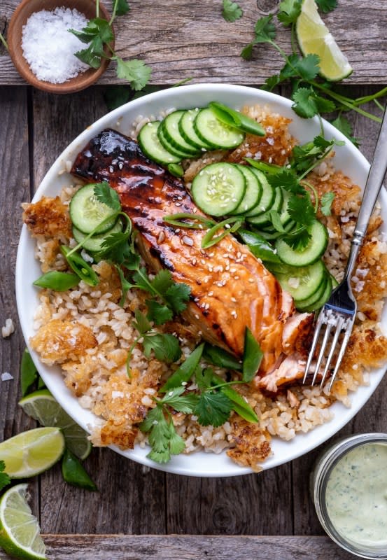 <p>Wandering Chickpea</p><p>These crunchy brown rice bowls are simple, easy to make and packed with flavor and texture. Loaded with sweet honey-glazed salmon, golden brown rice and a creamy herbed tahini dressing.</p><p><strong>Get the recipe: <a href="https://wanderingchickpea.com/2021/05/03/crunchy-brown-rice-bowls-with-salmon-and-herbed-tahini-dressing/" rel="nofollow noopener" target="_blank" data-ylk="slk:Crunchy Brown Rice Bowls with Salmon and Herbs Tahini Dressing;elm:context_link;itc:0;sec:content-canvas" class="link rapid-noclick-resp">Crunchy Brown Rice Bowls with Salmon and Herbs Tahini Dressing</a></strong></p>