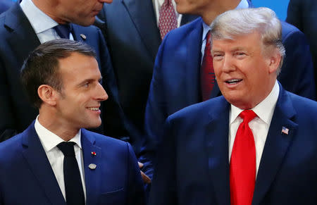 FILE PHOTO: French President Emmanuel Macron and U.S. President Donald Trump prepare for a photo during the G20 summit in Buenos Aires, Argentina November 30, 2018. REUTERS/Marcos Brindicci/File Photo