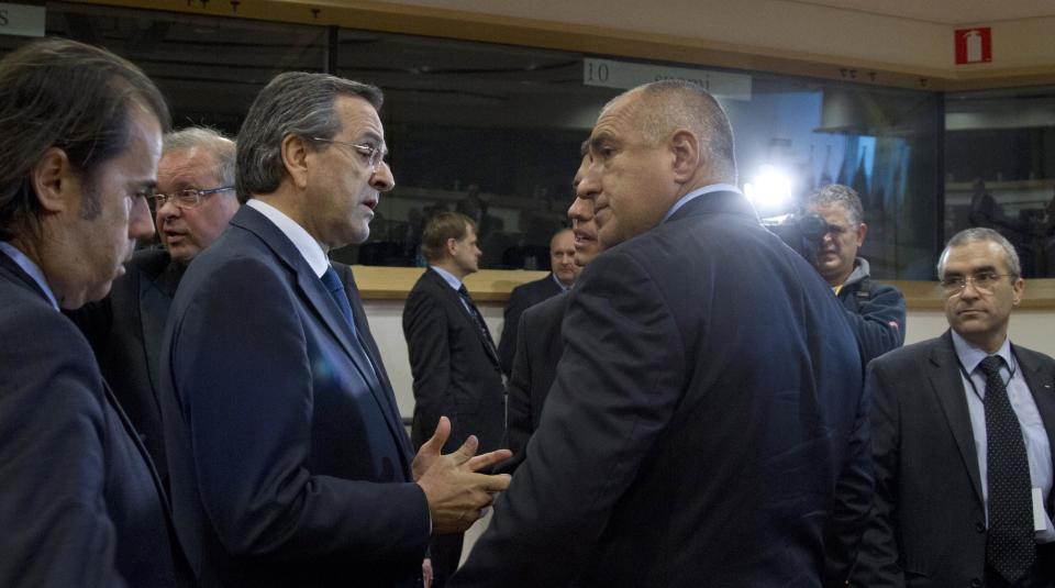 Greek Prime Minister Antonis Samaras, third left, speaks with Bulgaria's Prime Minister Boyko Borissov, third right, during a Friends of Cohesion meeting at the European Parliament in Brussels on Tuesday, Nov. 13, 2012. EU leaders met on Tuesday to discuss tactics ahead of the battle for the EU budget. (AP Photo/Virginia Mayo)